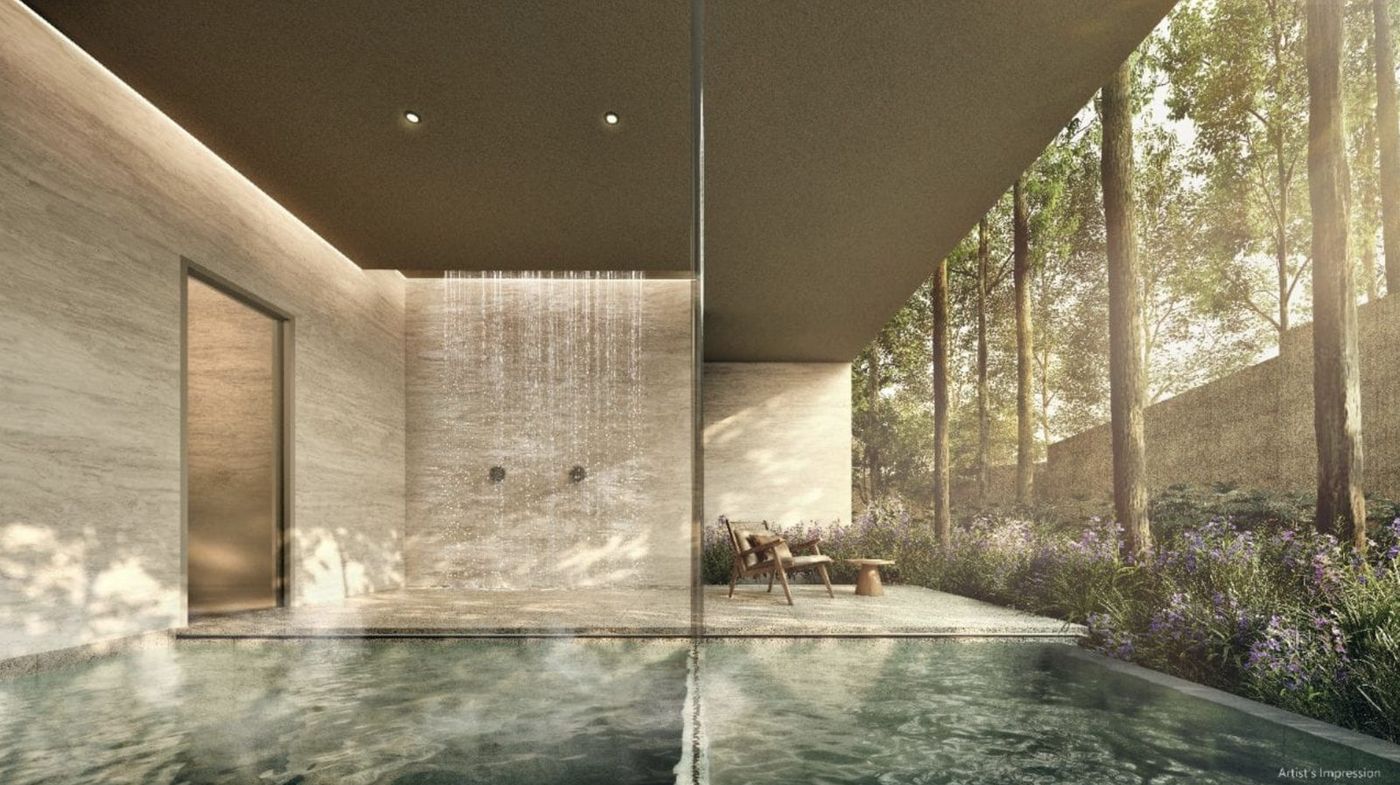 Rain shower pavilion beside the wellness pool, framed by mature trees